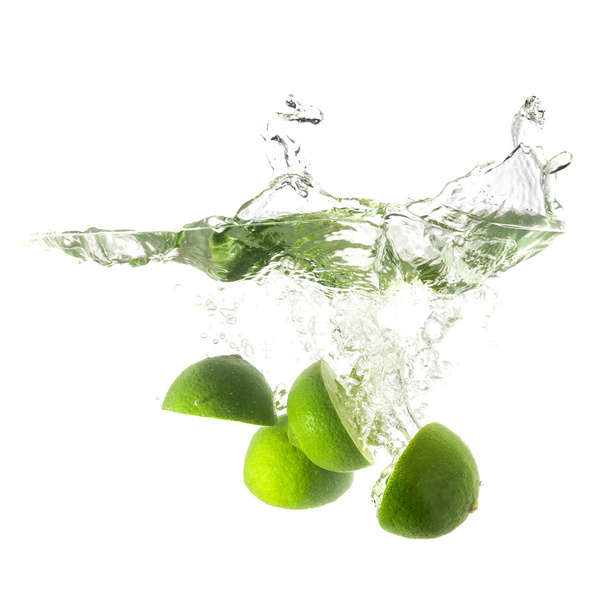 Limes splash on water, isolated on white background. - Foto, immagini