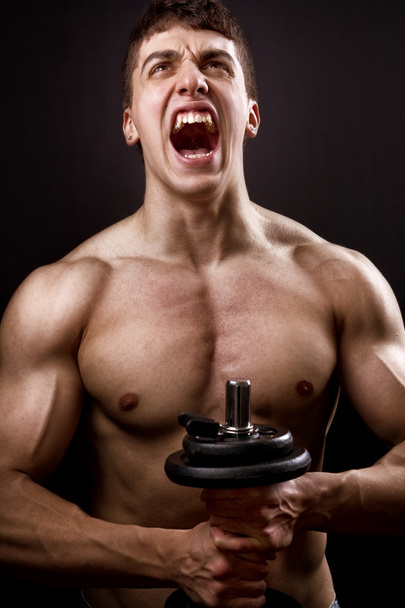 Scream of powerful muscular bodybuilder - Фото, изображение