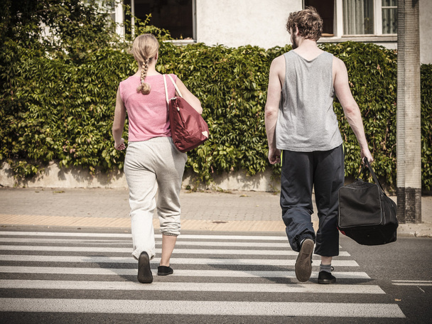 Couple man and woman with sport bags. - Foto, immagini