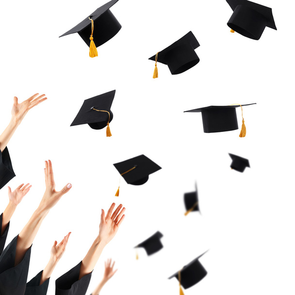 Graduates hands throwing graduation hats - Φωτογραφία, εικόνα