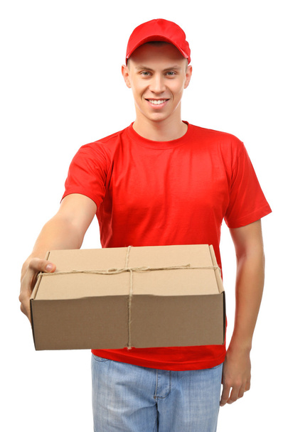 Delivery man with a carton package - Foto, immagini