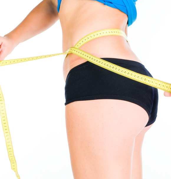 Woman diet concept with measuring tape - Foto, imagen