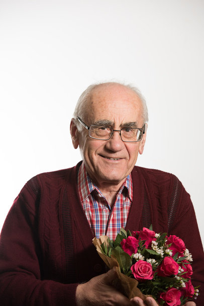 old man with flowers - Fotoğraf, Görsel