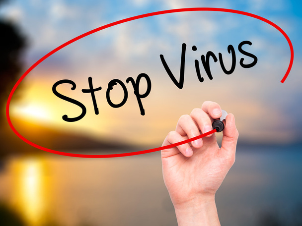 Man Hand writing Stop Virus with black marker on visual screen - Foto, immagini