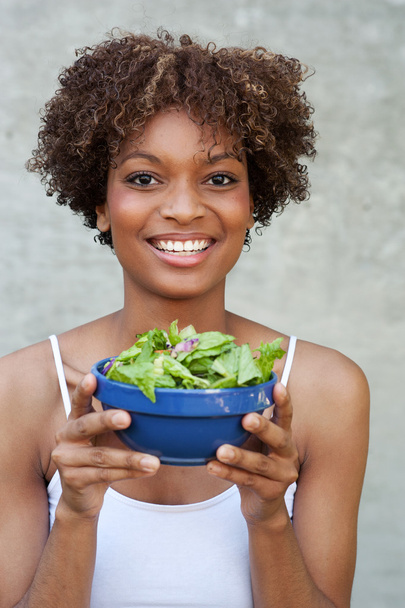 Pretty African American woman with salad - Zdjęcie, obraz