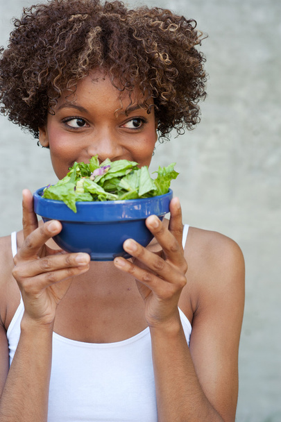 Pretty African American woman with salad, healthy lifestyle - Фото, зображення