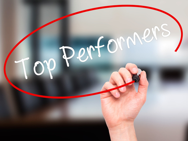 Man Hand writing Top Performers with black marker on visual scre - Photo, Image