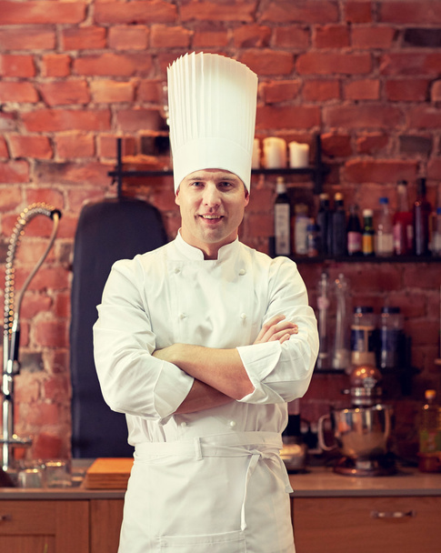 happy male chef cook in restaurant kitchen - Zdjęcie, obraz