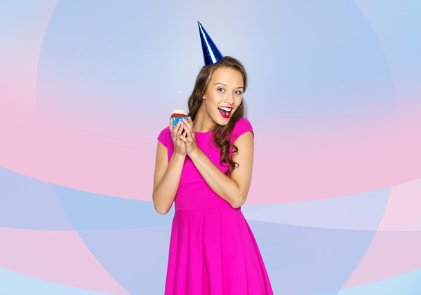 happy woman or teen girl with birthday cupcake - Zdjęcie, obraz