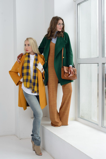 Girls in studio posing at coats - Foto, immagini