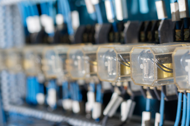 Row of  blue and yellow blured Relay actuators - Photo, Image