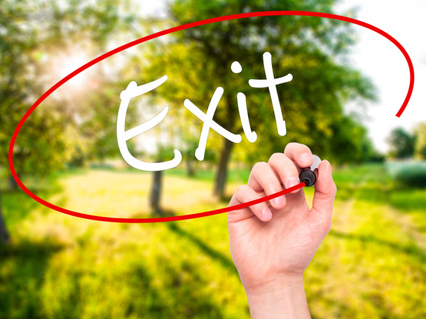 Man Hand writing Exit with black marker on visual screen - Photo, Image