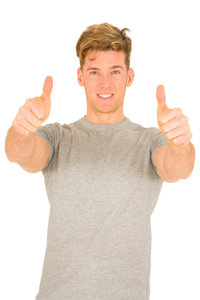 Young man with thumbs up - Photo, Image