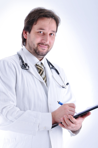 Young attractive male doctor in characteristic clothes - 写真・画像