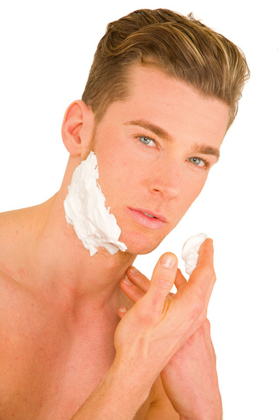 Young man shaving - 写真・画像
