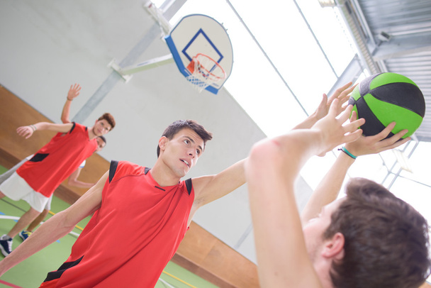 Young men playing basket ball - Photo, Image