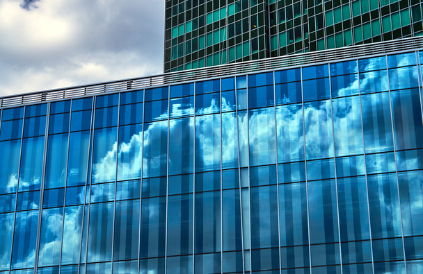 Reflection of the sky and clouds in Glass facade - Photo, Image