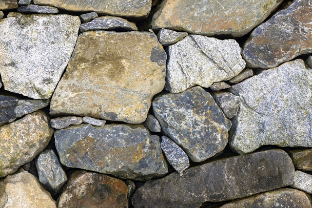 Pared de piedra de granito con piedras de colores
 - Foto, imagen