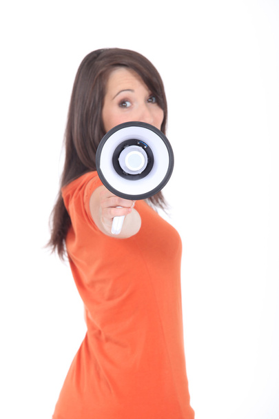 Profile view of young woman holding megaphone - Foto, Imagen