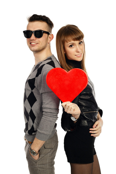 Beautiful smiling couple on white background with red heart - Φωτογραφία, εικόνα
