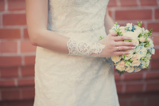Beautiful wedding bouquet in hands of the bride - Фото, изображение