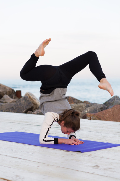 Sportive woman practicing yoga - Photo, Image