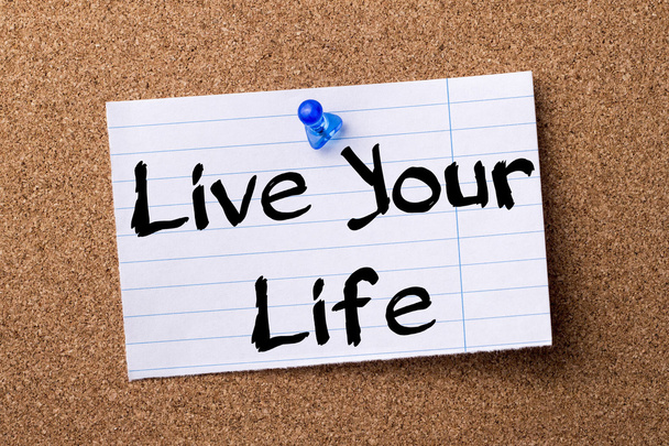 Live Your Life - teared note paper pinned on bulletin board - Photo, image