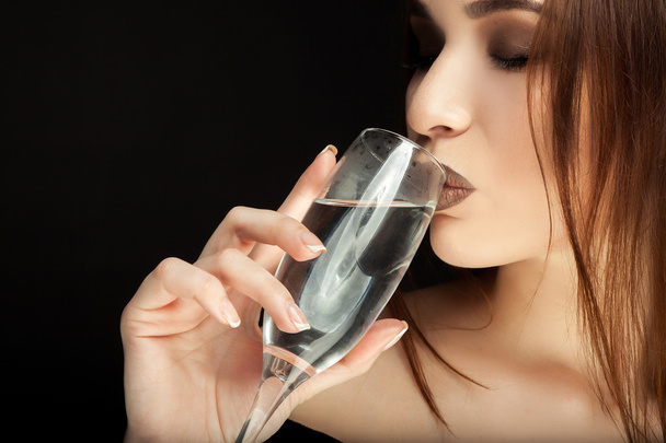 beautiful girl is drinking white wine  - Zdjęcie, obraz