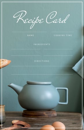 Teapot on wooden table with Eggs Recipe Card Modelo de Design