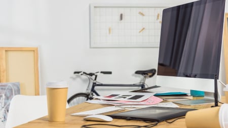 Platilla de diseño Home Workplace with bike and cups of Coffee Zoom Background