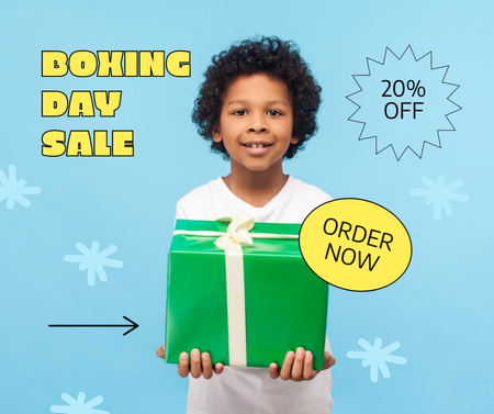 Platilla de diseño Boxing Day Sale with Cute Boy holding Gift Facebook