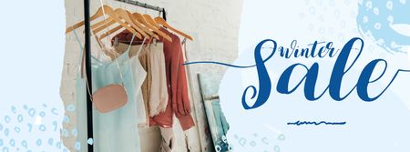 Plantilla de diseño de Winter Sale Offer Clothes on Hanger Facebook cover 