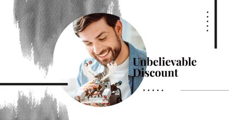 Template di design Discount Offer with Man holding Robot Facebook AD