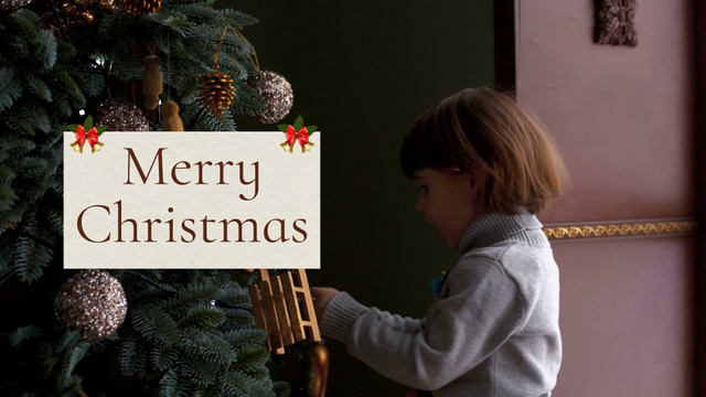 Platilla de diseño Cute Child decorating Christmas Tree Full HD video
