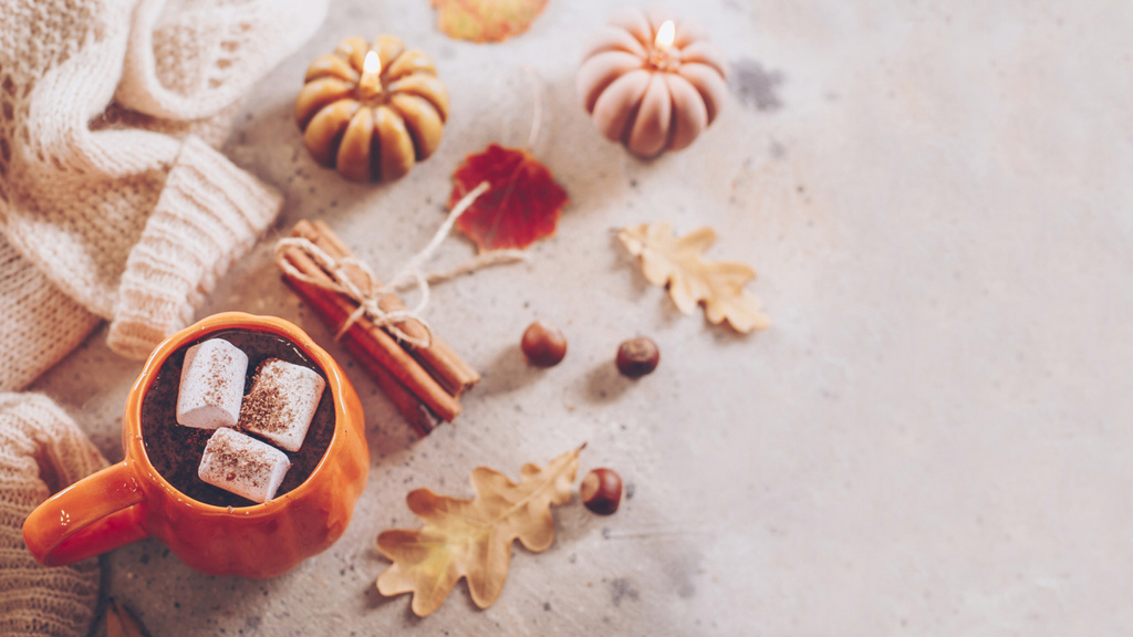 Autumn Mood with Warm Drink and Cozy Pumpkin Shaped Candles Zoom Backgroundデザインテンプレート