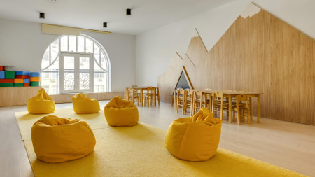 söpö lastentarha sisustus pehmeällä keltaisella nojatuolilla Zoom Background Design Template