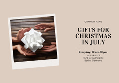 July Christmas Sale with Happy Couple holding Gifts