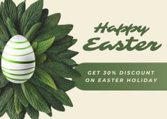 Easter Promotion with Easter Egg in Nest Made of Green Leaves